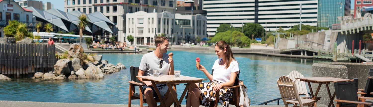 couple eating at water front